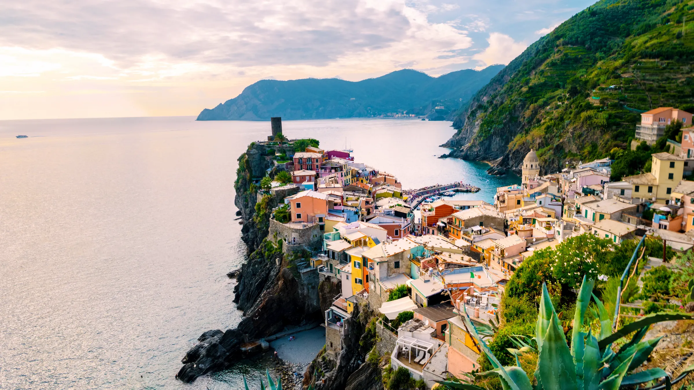 Italian sunset on colourful houses in Vernazza on the Cinque Terre coastline — Eventra Bespoke luxury European travel