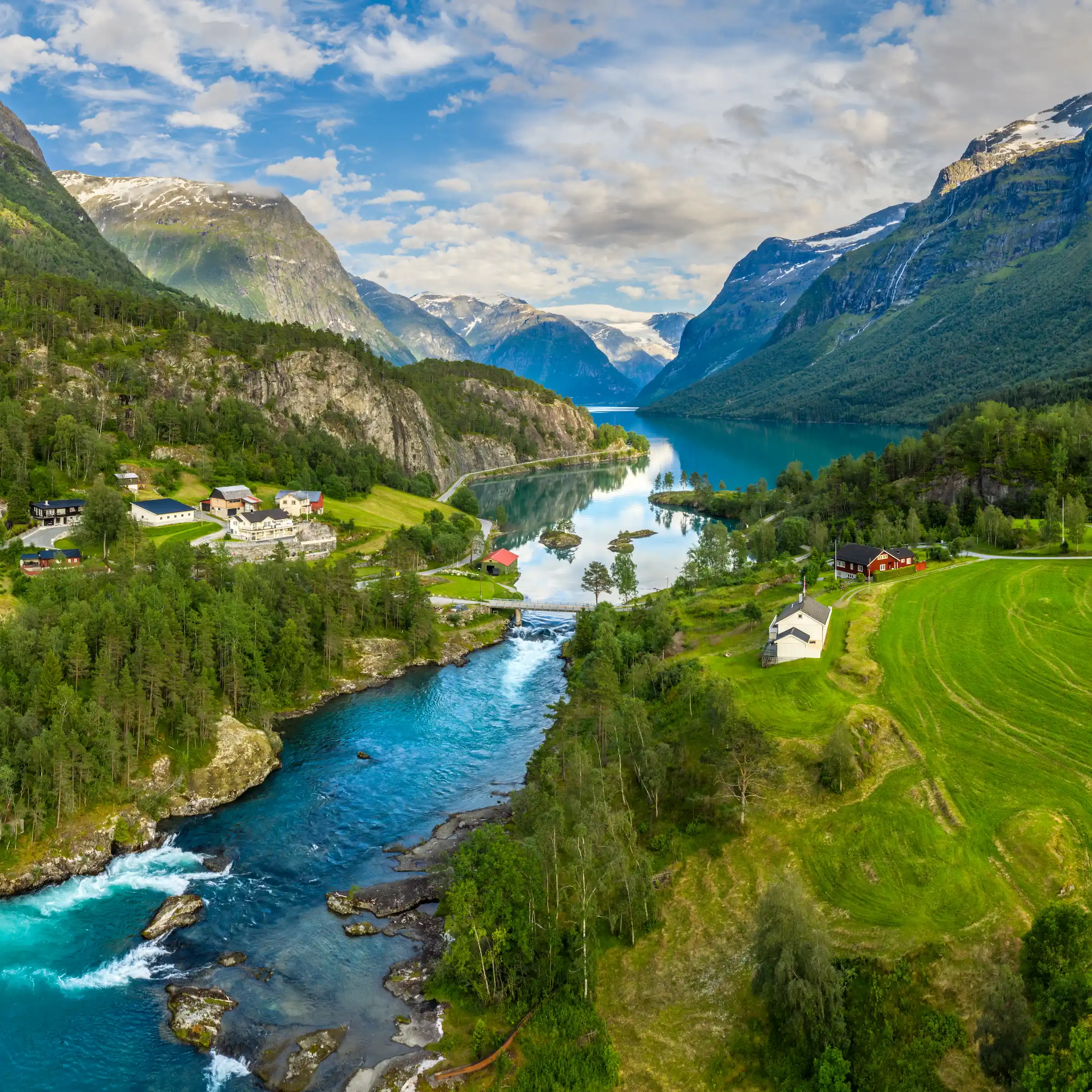 Lake and river between beautiful Norwegian mountains — luxury Nordic and Eastern Europe travel with Eventra Bespoke