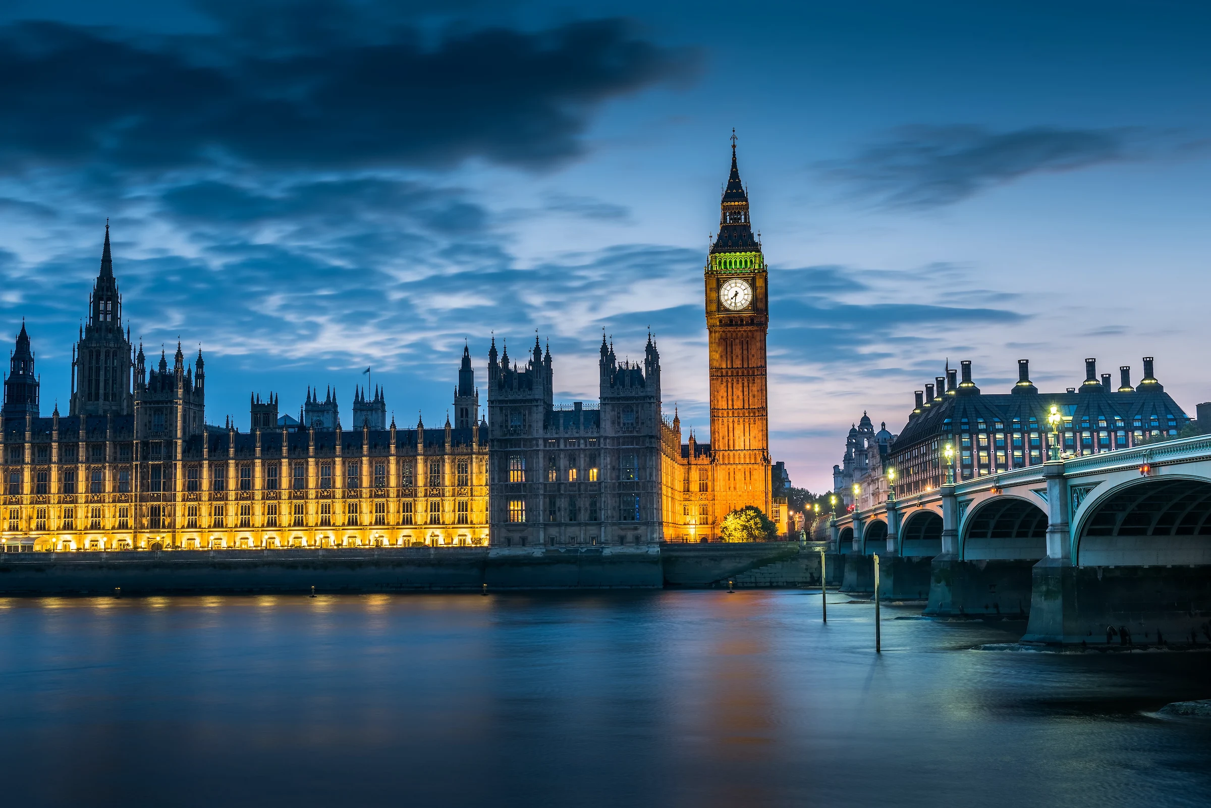 London Houses of Parliament, Big Ben and the River Thames under a night sky — luxury UK and Ireland travel with Eventra Bespoke