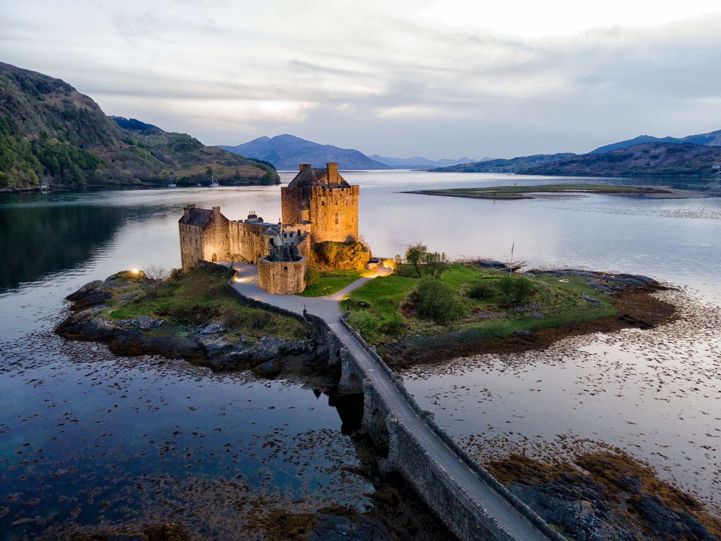Eilean Donan Castle on a tidal island where three sea lochs meet in the Scottish Highlands — luxury Scotland travel with Eventra Bespoke