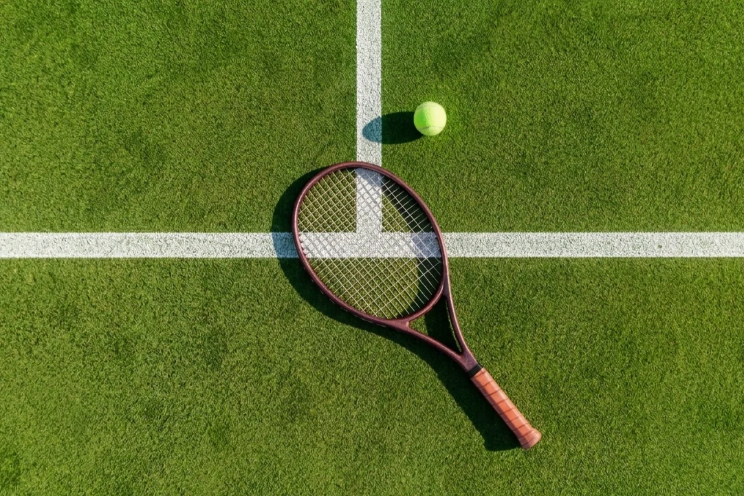 Wimbledon Tennis court with racket and ball